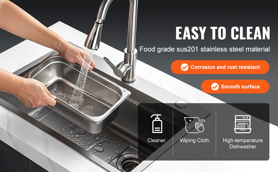 washing VEVOR hotel pans under a faucet; stainless steel, corrosion-resistant, smooth surface.