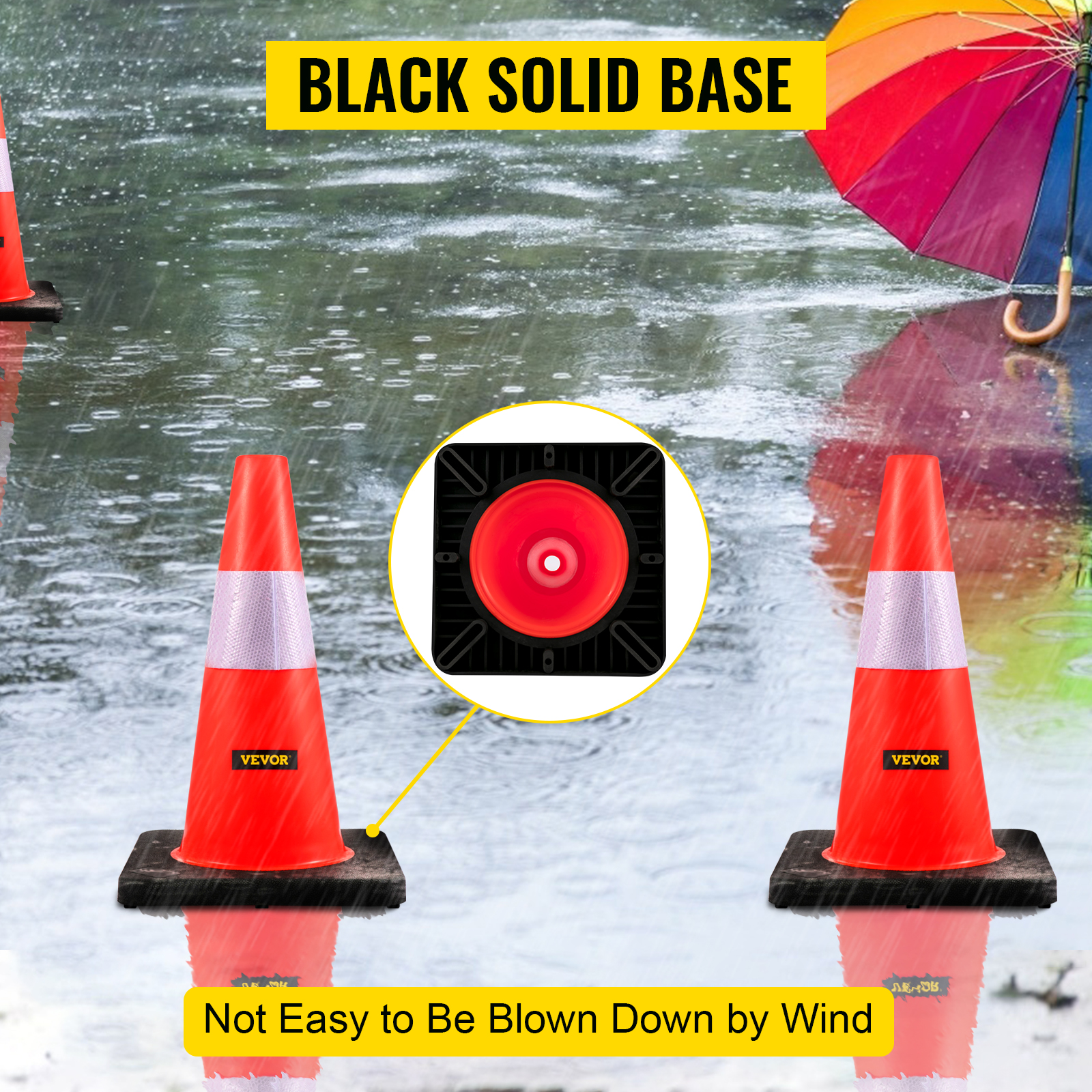 VEVOR safety cones with black solid bases on a wet surface in rainy weather.