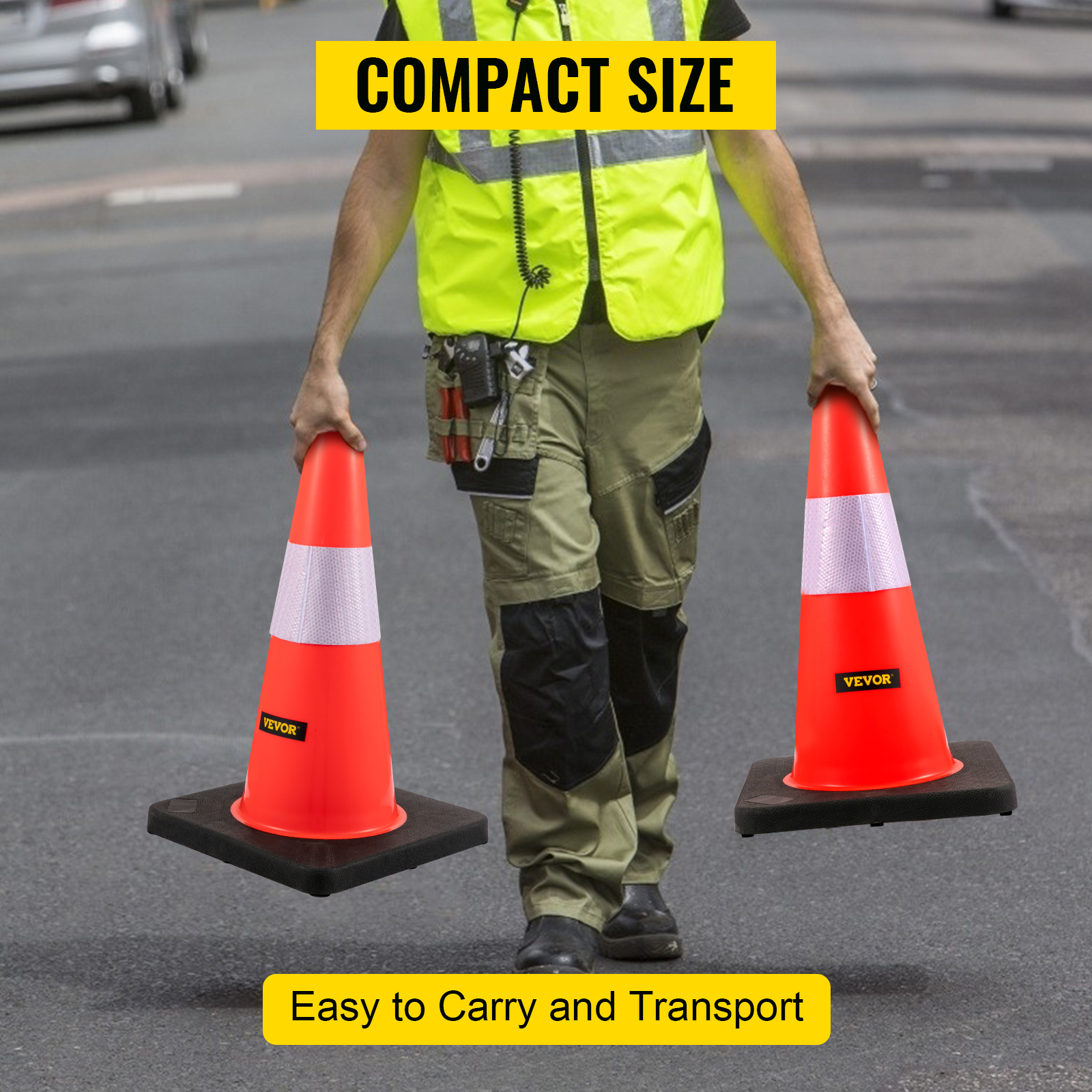 worker holding VEVOR safety cones, demonstrating easy transport on a road.