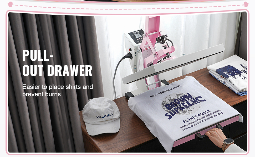 VEVOR heat press machine with pull-out drawer, pressing a t-shirt. baseball cap and shirts nearby.