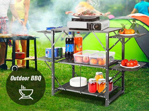 VEVOR camping kitchen table setup with bbq, food, drinks, and a green tent in the background.