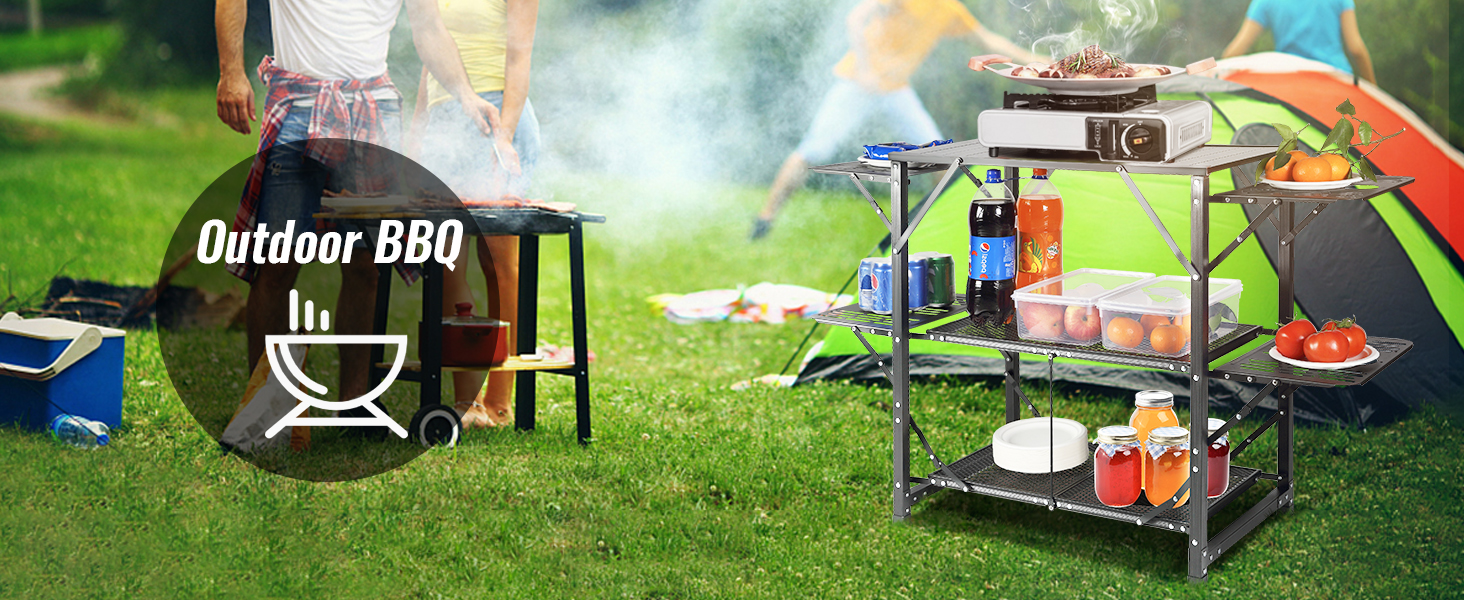 VEVOR camping kitchen table setup with bbq, food, drinks, and a green tent in the background.