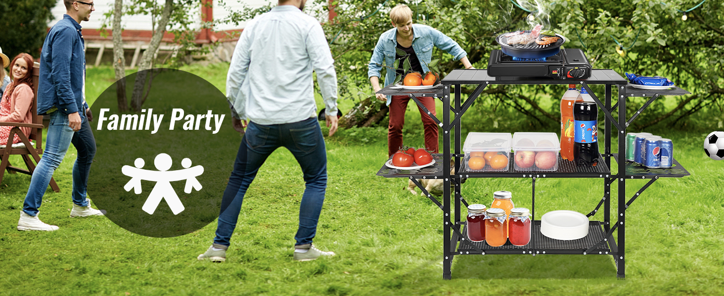 family gathering with VEVOR camping kitchen table, bbq grill, and organized shelves on a lawn.