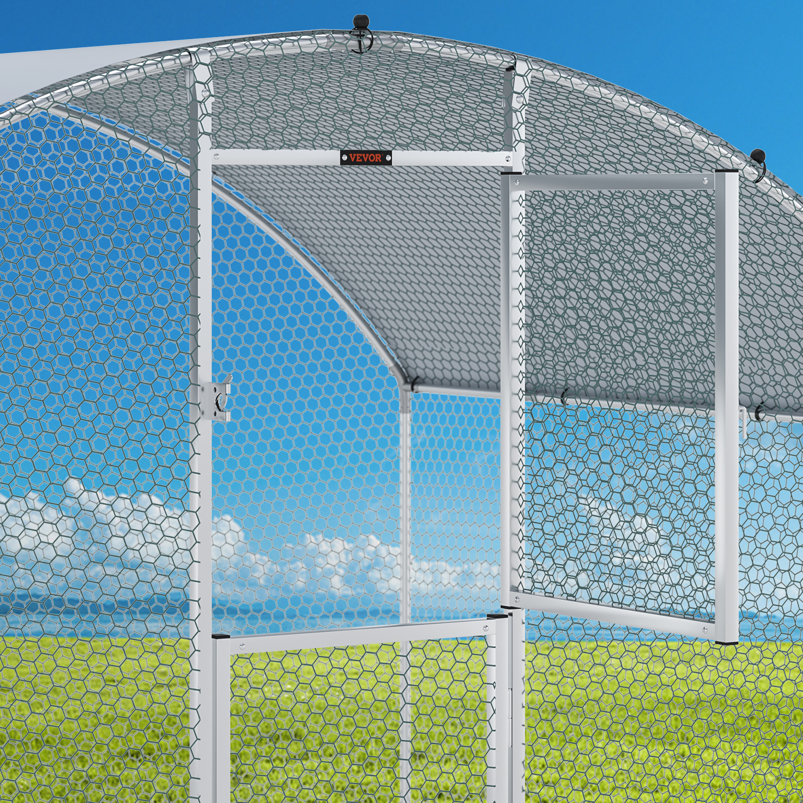 VEVOR chicken coop with metal frame and wire mesh under clear blue sky and green field background.
