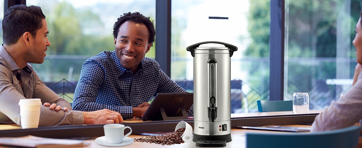 VEVOR coffee urn on a table, surrounded by people in a meeting with coffee and coffee beans nearby.