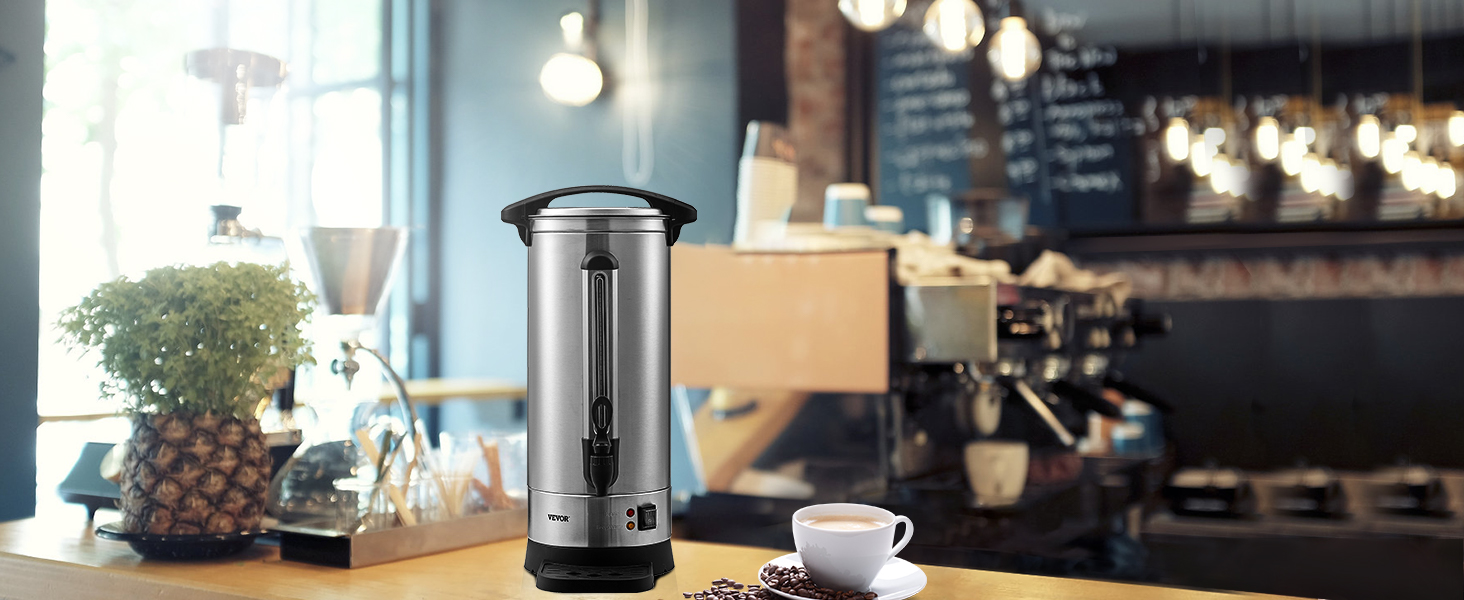 VEVOR coffee urn on a cafe counter with coffee beans, a cup, and blurred background lighting.