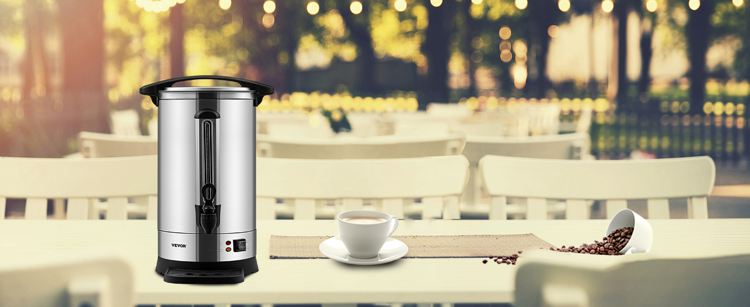 VEVOR coffee urn on a table with spilled coffee beans and a cup, set in an outdoor café environment.