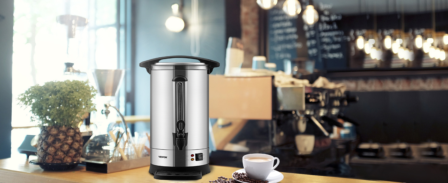 VEVOR coffee urn in a cozy café setting with a cup of coffee, espresso machine, and decorative plants.