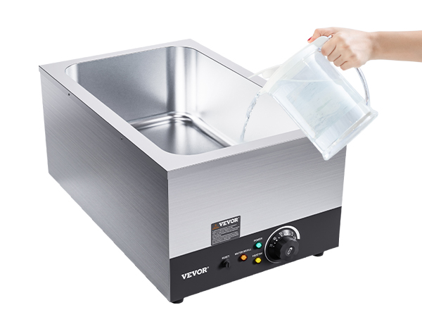 hand pouring water into VEVOR commercial food warmer with stainless steel interior and control knob.