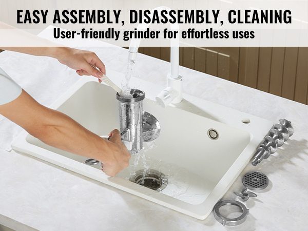 person cleaning VEVOR manual meat grinder parts in a kitchen sink, showcasing easy maintenance.