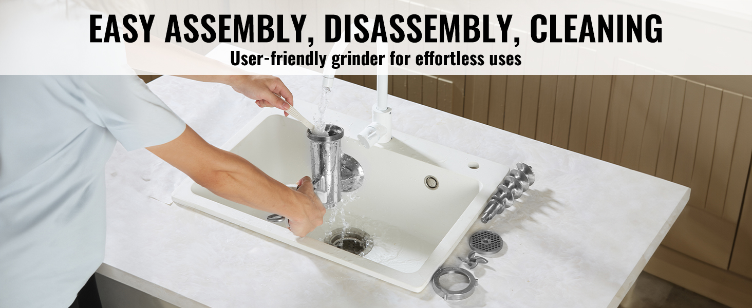person cleaning VEVOR manual meat grinder parts in a kitchen sink, showcasing easy maintenance.