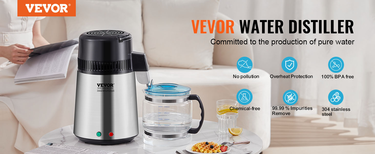 VEVOR water distiller on table, glass container, brochure, breakfast plate, sofa in background.