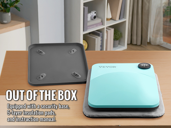 Термопресс-машина VEVOR с защитным основанием, изоляционными прокладками и инструкцией по эксплуатации на столе.