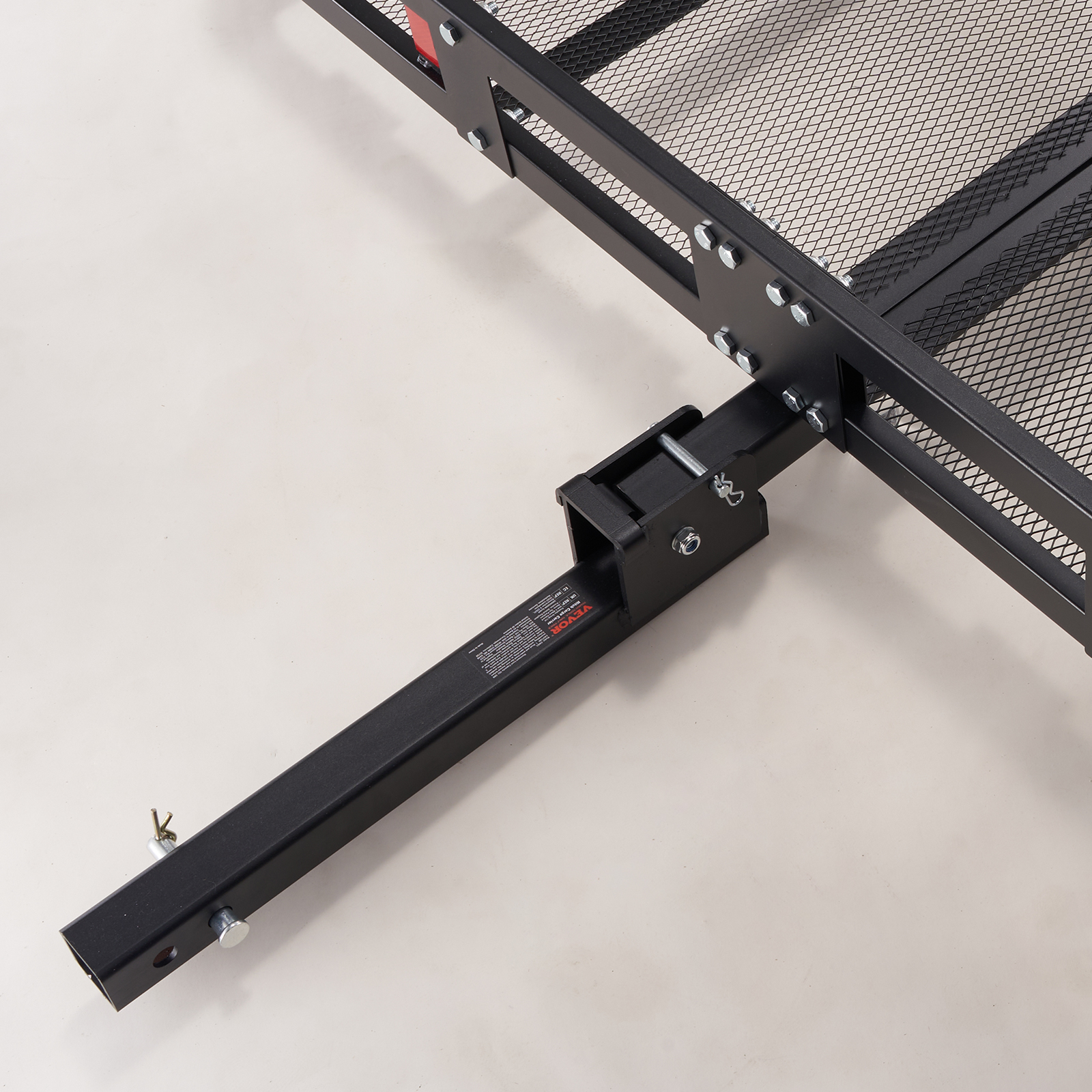VEVOR hitch cargo carrier close-up, black metal frame with mesh, sturdy attachment mechanism.