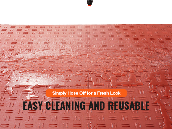 VEVOR garage tiles being hosed off, highlighting their easy cleaning and reusable features.