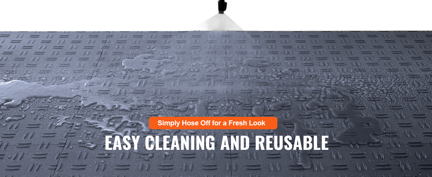 spraying water on VEVOR garage tiles for easy cleaning and reusable functionality.