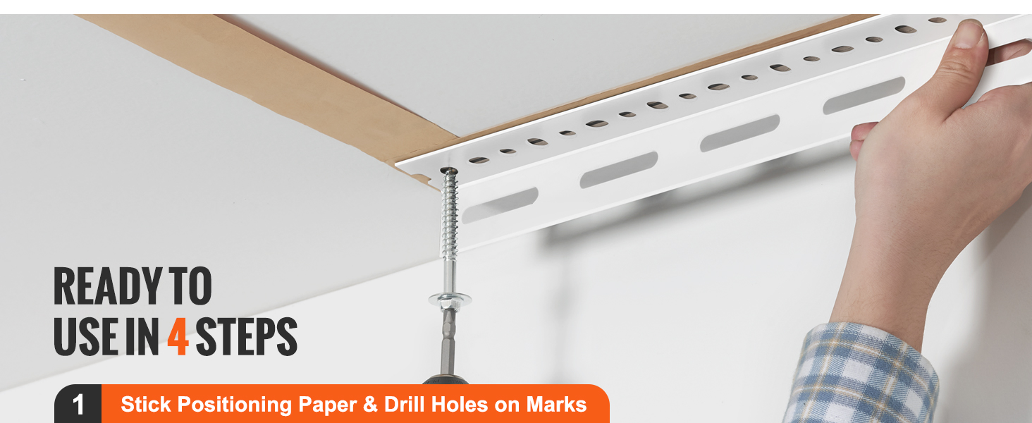 hand installing the VEVOR overhead garage storage rack with a drill and positioning paper.