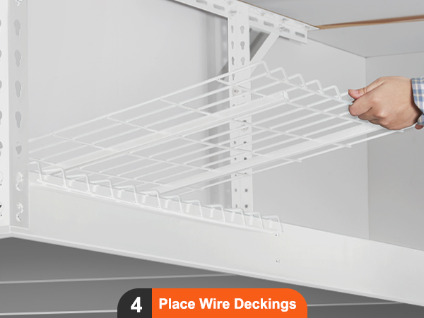 person assembling VEVOR overhead garage storage rack by placing wire deckings into the white metal frame.