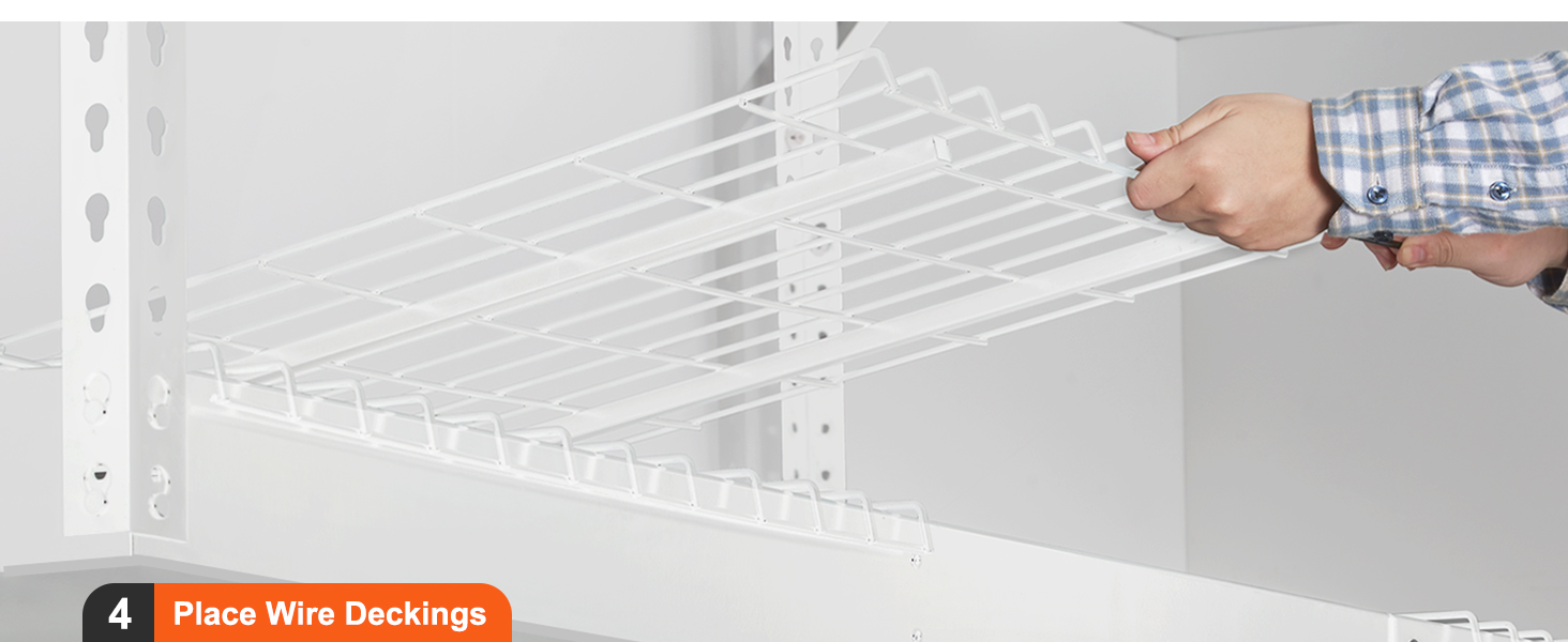 person assembling VEVOR overhead garage storage rack by placing wire deckings into the white metal frame.