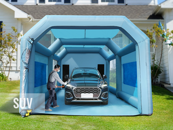 VEVOR inflatable paint booth with suv inside, positioned in a residential yard, person preparing to work.