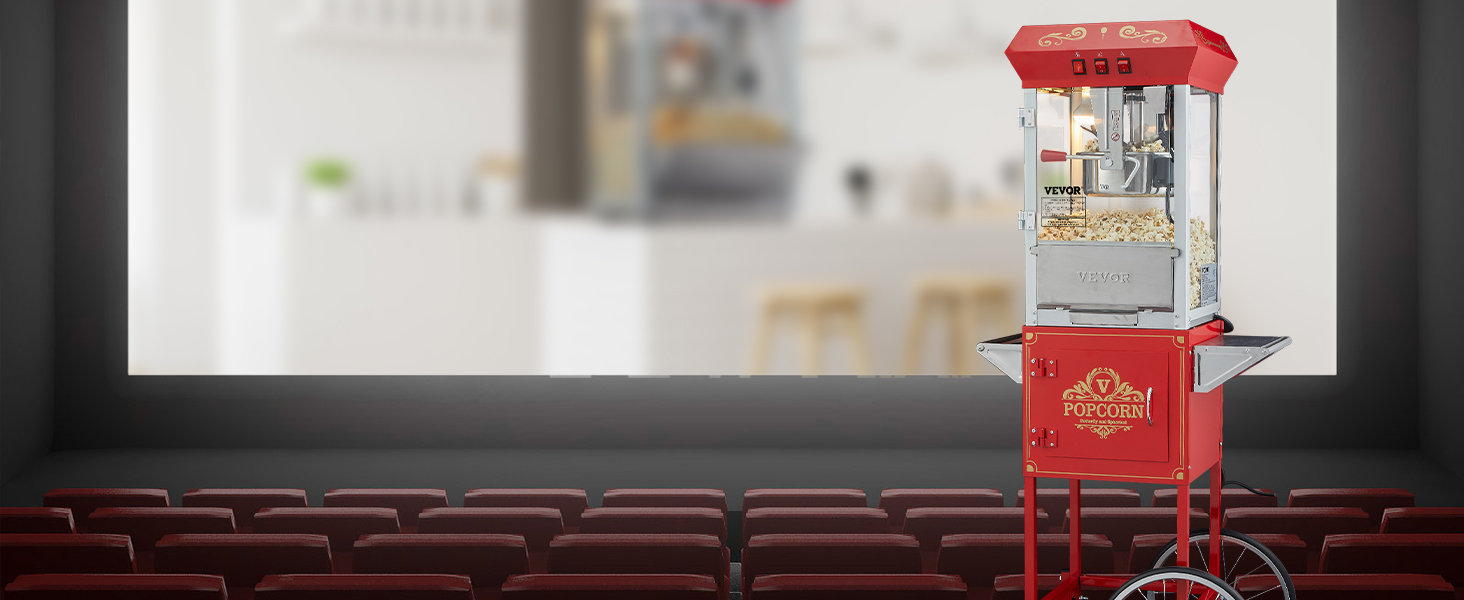 red VEVOR popcorn popper machine on wheels in an empty theater with red seats and a screen background.