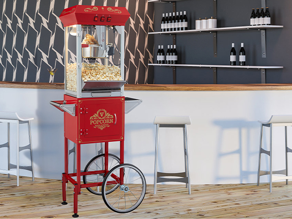 VEVOR popcorn popper machine in a modern bar setting with wooden flooring and stylish decor.
