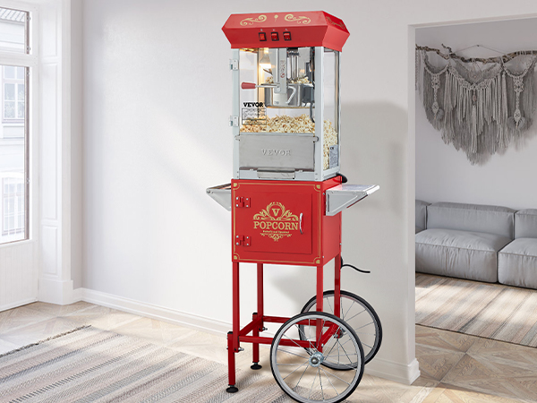 red VEVOR popcorn popper machine with wheels in modern living room near large window.