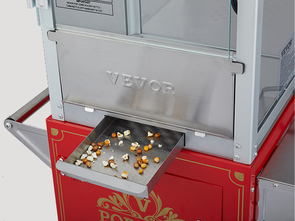VEVOR popcorn popper machine with stainless steel drawer and red base, showcasing scattered popcorn.
