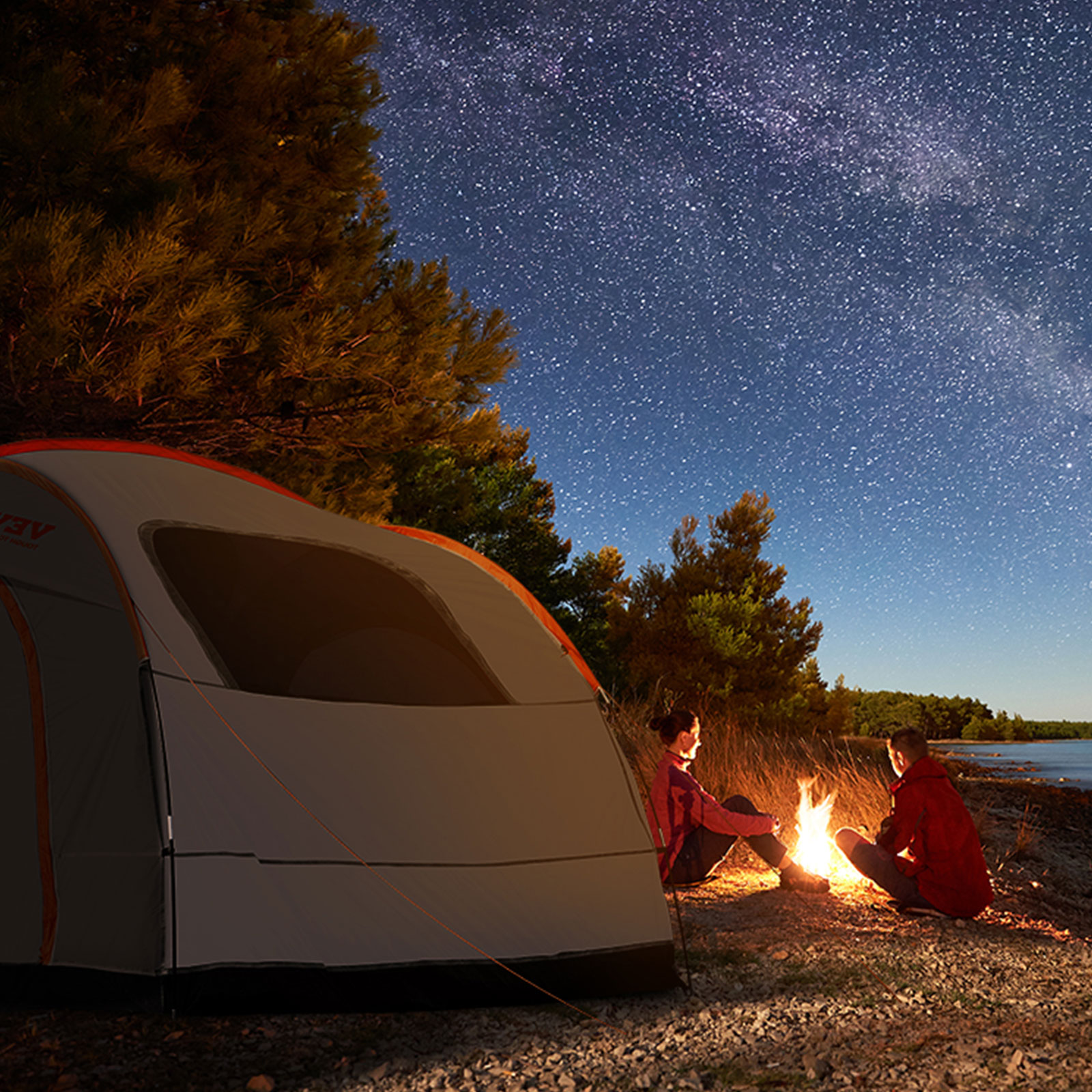 camping under starry skies with the VEVOR suv camping tent near a campfire by the lake.