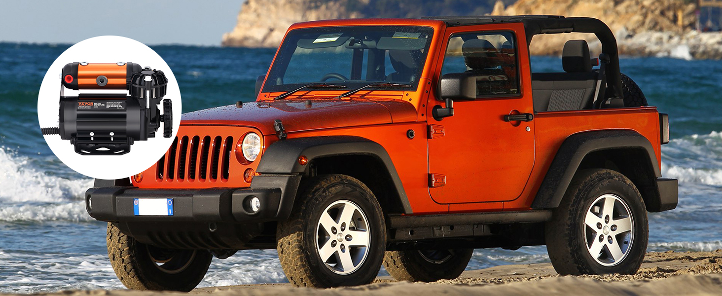 orange jeep by the beach with VEVOR onboard air compressor kit; mountains and ocean background