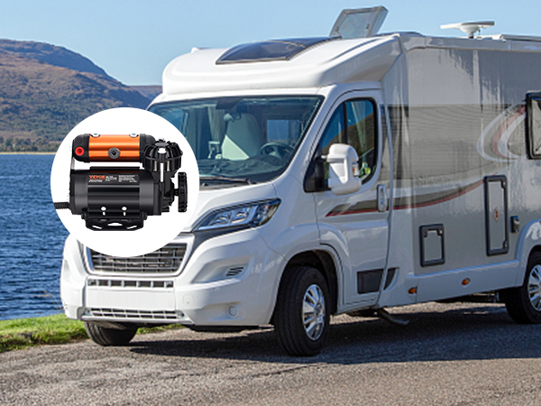rv parked near a scenic lake with a VEVOR onboard air compressor kit overlay.