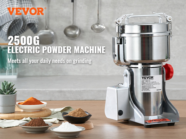 VEVOR electric grain mill with bowls of colorful powders, utensils, and plants on a kitchen countertop.