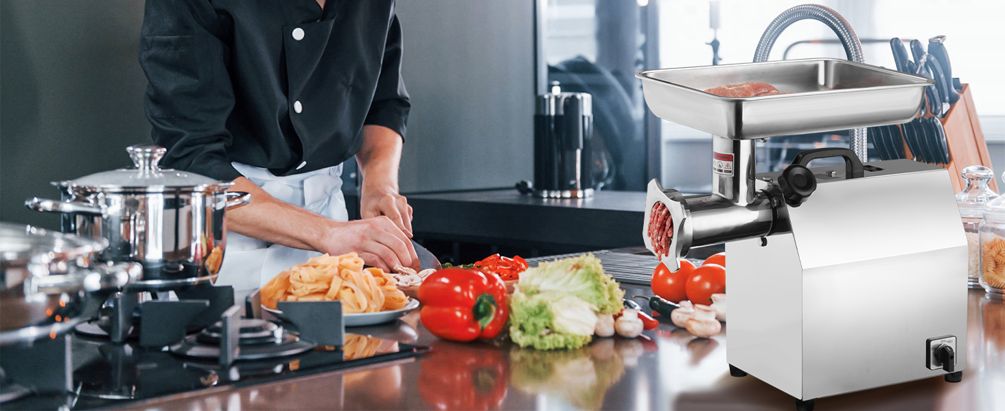 cook preparing vegetables and meat beside a VEVOR electric meat grinder in a modern kitchen.