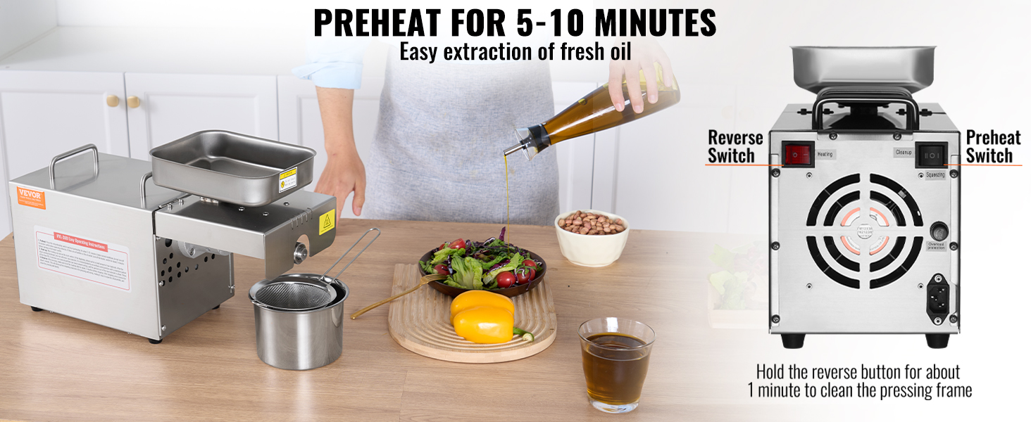VEVOR oil press machine with switch controls on a kitchen counter, preparing salad.