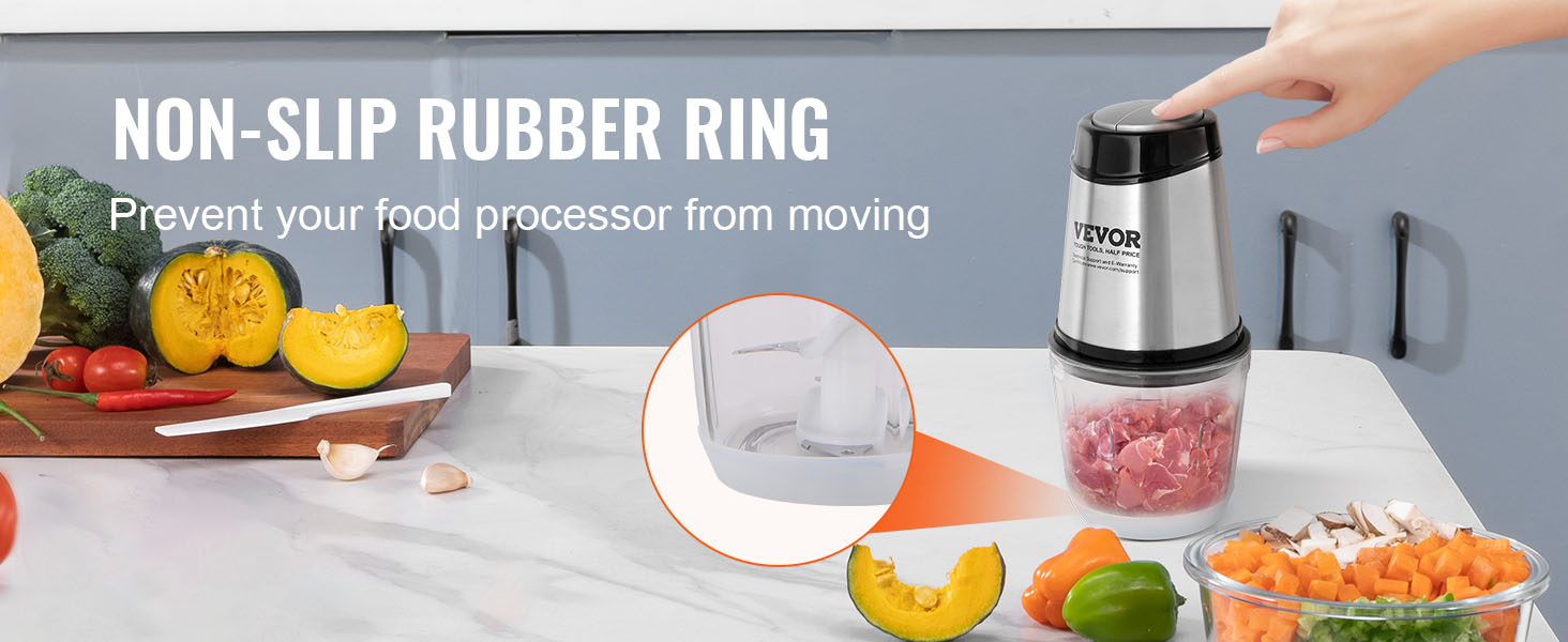 VEVOR food processor with non-slip rubber ring, fresh vegetables on the table, hand pressing lid.