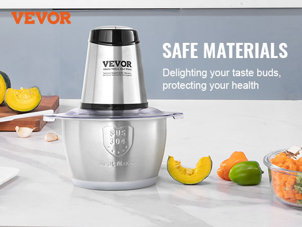 VEVOR electric meat grinder in stainless steel with fresh vegetables on a kitchen counter.