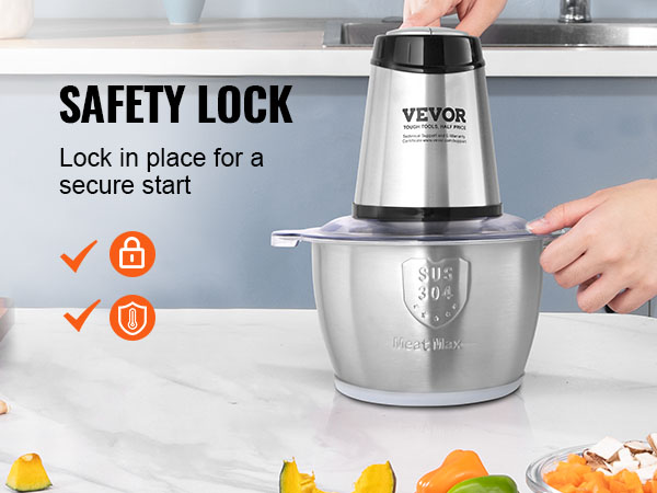 VEVOR electric meat grinder with safety lock, placed on a kitchen counter near vegetables.