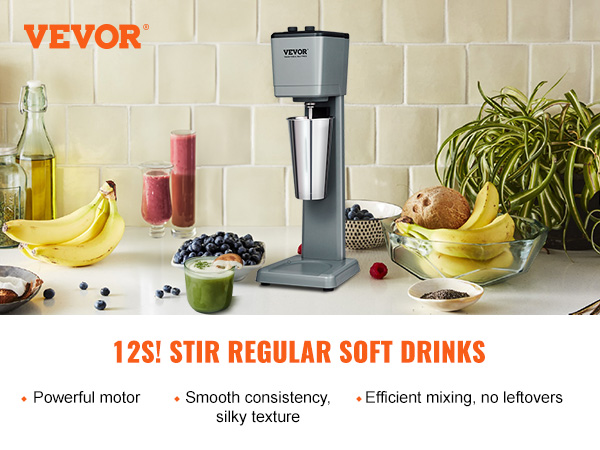 VEVOR milkshake maker on a kitchen counter with bananas, berries, and drinks.
