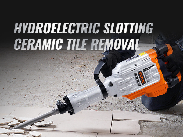 person using VEVOR demolition jack hammer to break ceramic tiles in a construction setting.