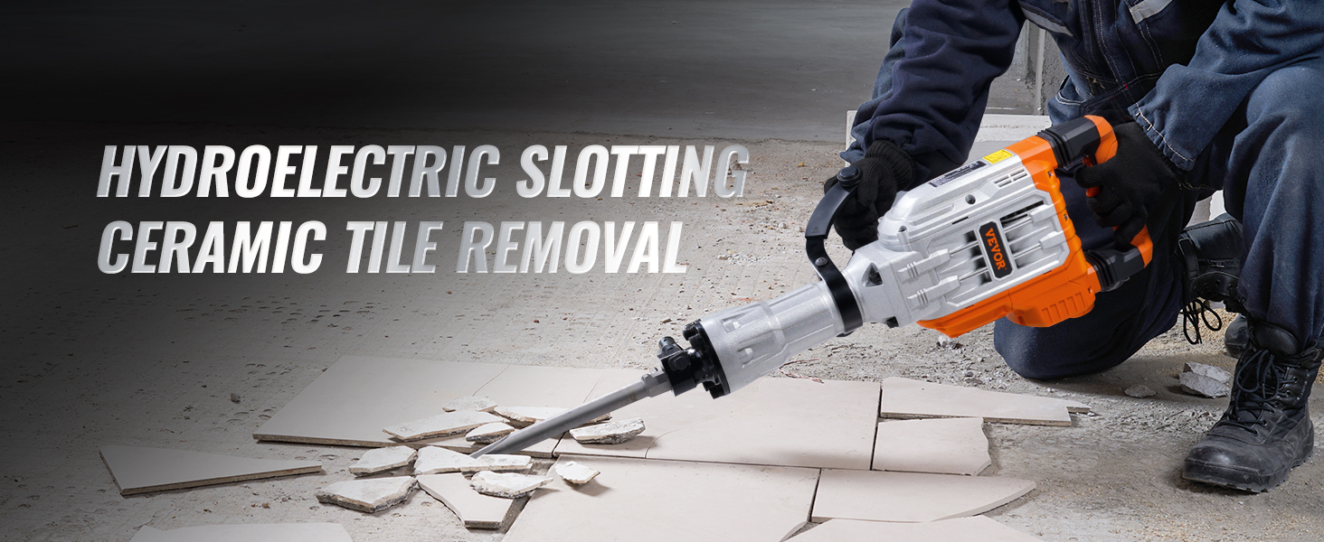 person using VEVOR demolition jack hammer to break ceramic tiles in a construction setting.