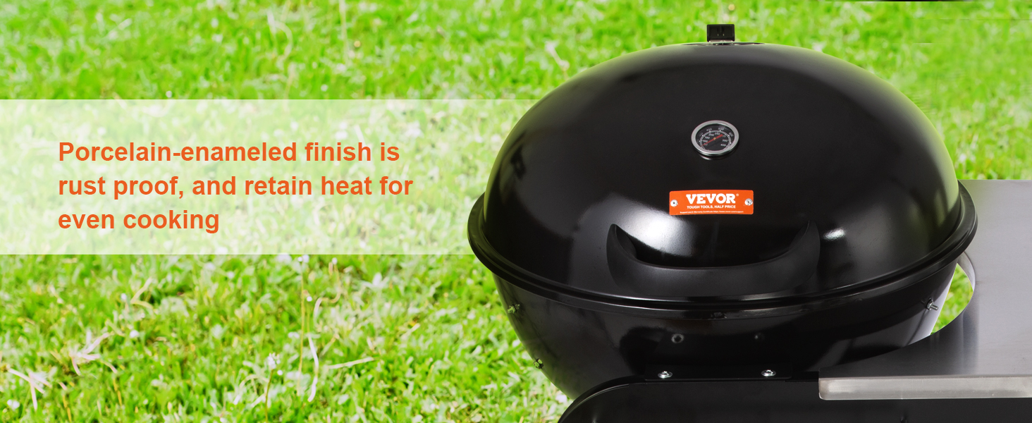 black VEVOR charcoal grill on green grass with heat-retentive porcelain-enamel finish for even cooking.