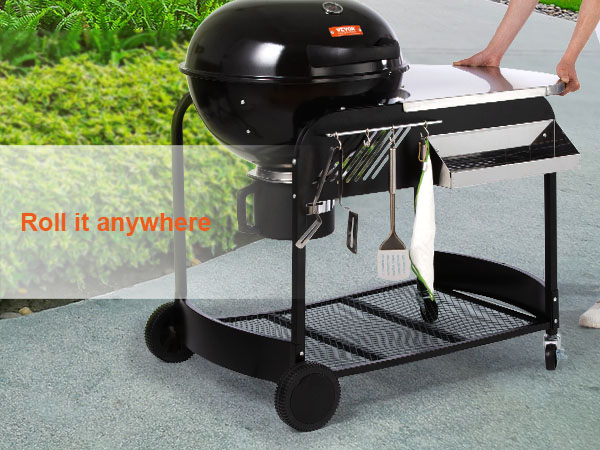 VEVOR charcoal grill on wheels with side table and hanging utensils in a garden setting.