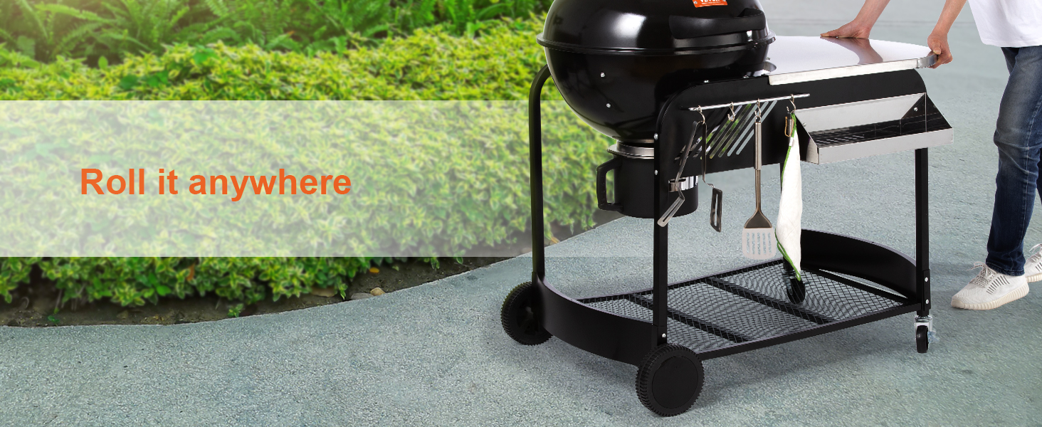 VEVOR charcoal grill on wheels with side table and hanging utensils in a garden setting.
