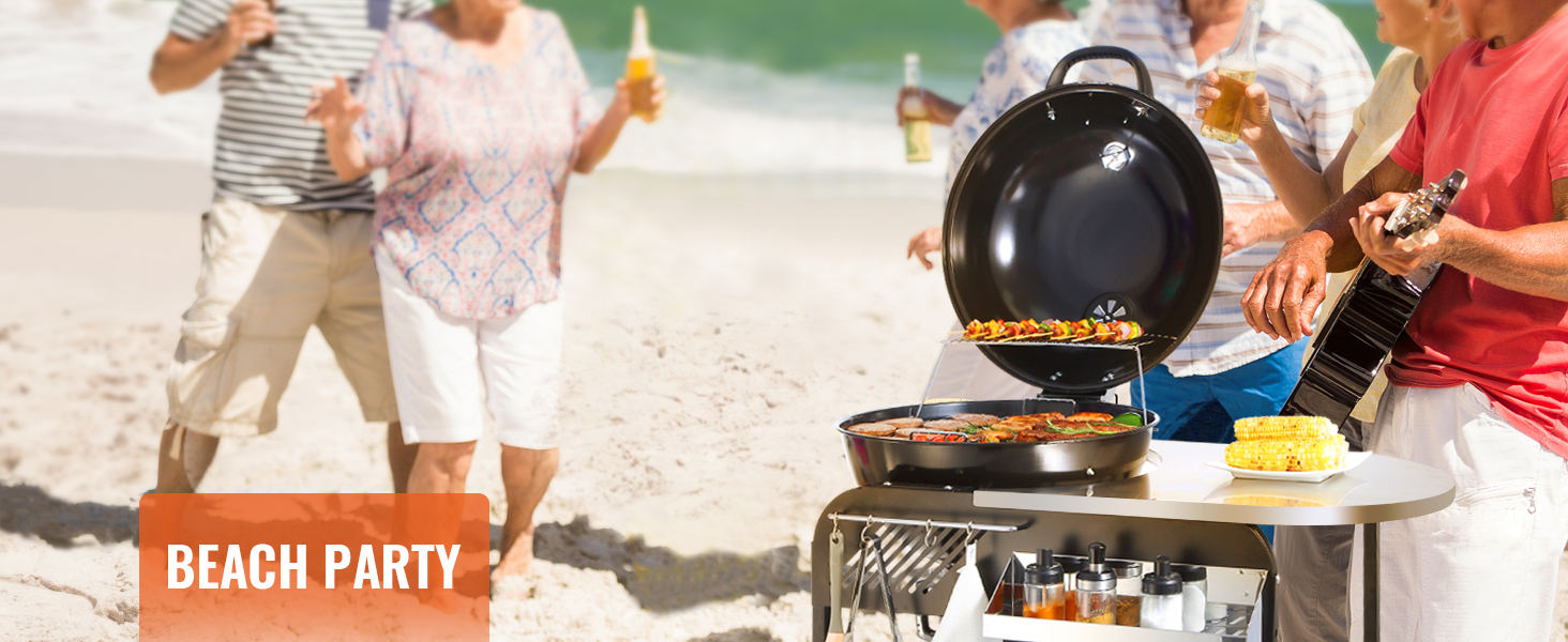 beach party with friends grilling on a VEVOR charcoal grill and enjoying drinks by the shore.