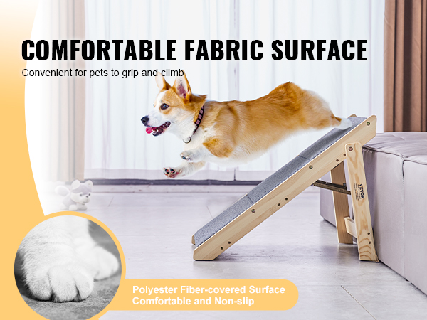corgi using VEVOR pet stairs with comfortable fabric surface to climb onto a sofa, in a living room.