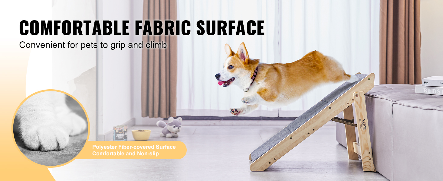 corgi using VEVOR pet stairs with comfortable fabric surface to climb onto a sofa, in a living room.