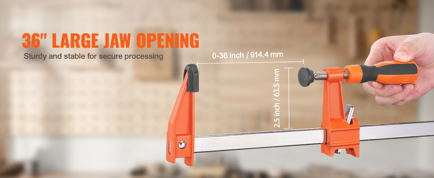 36" VEVOR bar clamp with large jaw opening for secure processing in a workshop setting.