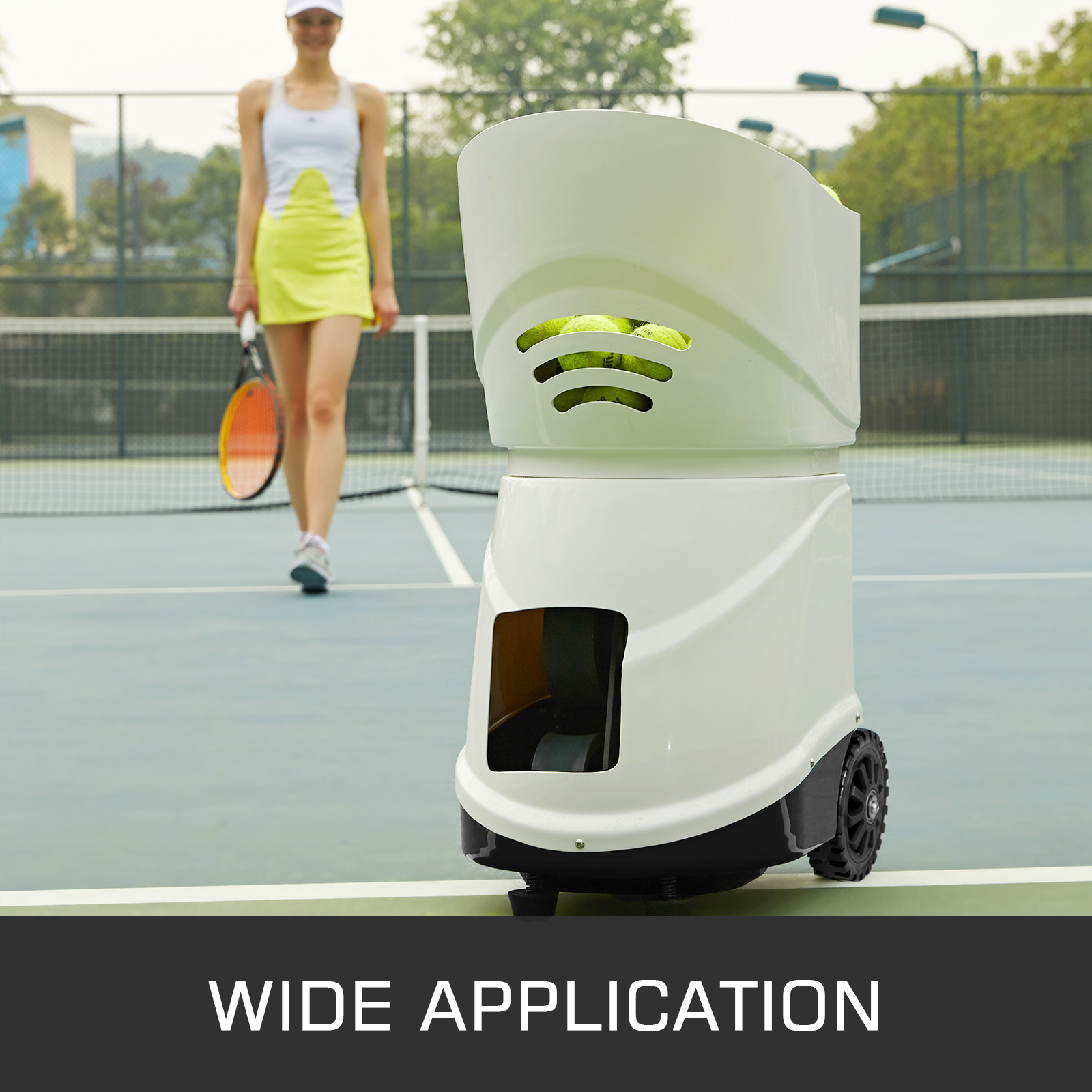VEVOR portable tennis ball machine on court, tennis player in background. wide application.