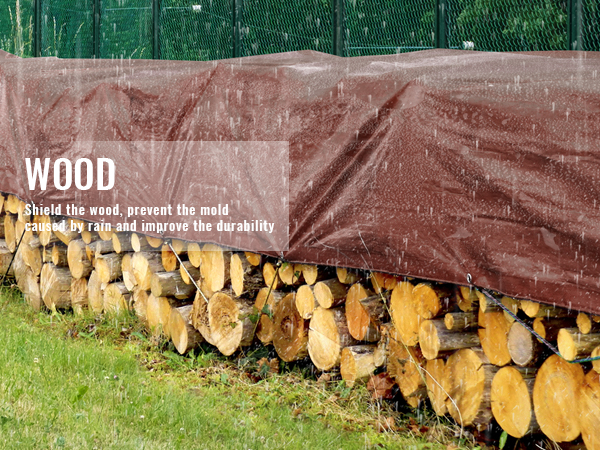VEVOR extra thick waterproof tarp covers stacked wood in the rain, protecting it from moisture.