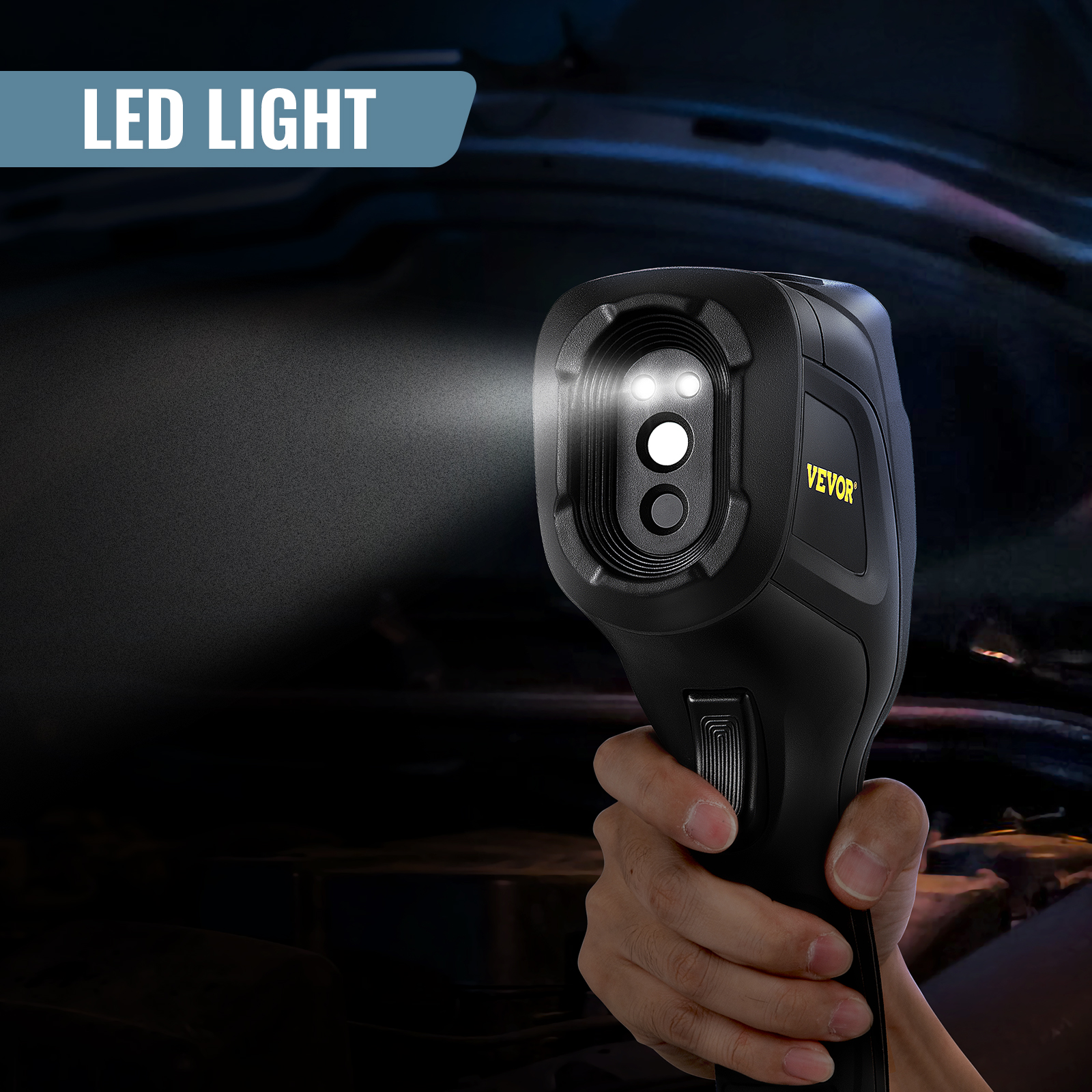 hand holding VEVOR thermal imaging camera with bright led light, illuminating a dark background.